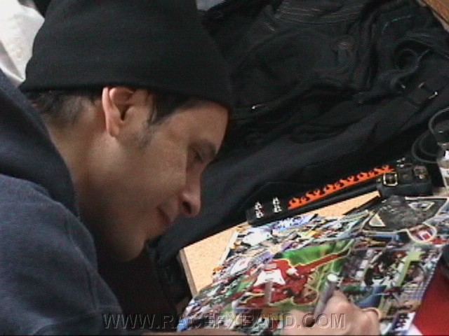 61. John signs after the show..jpg