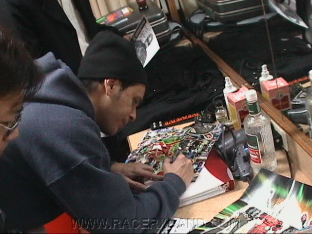 62. John signs some stuff..jpg