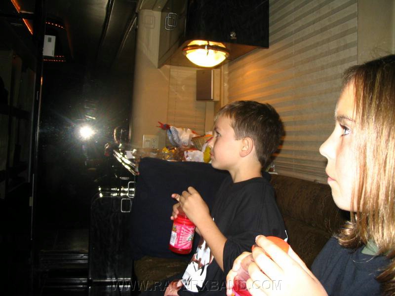 84. Kenan and Monica...drinking freebies on the bus..jpg