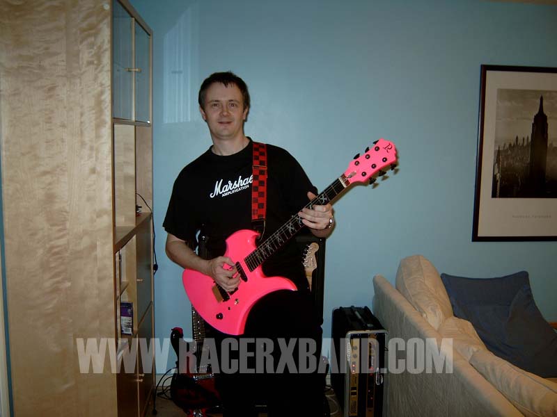 04. Jim holding the famed BC Rich guitar..jpg